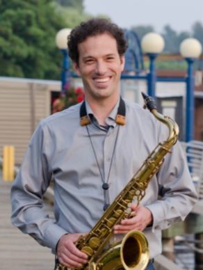 Mr. Paul Gillespie, holding a saxophone