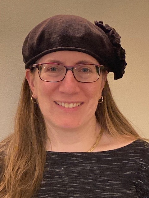 Dr. Shira Katsman, headshot on an off-white background