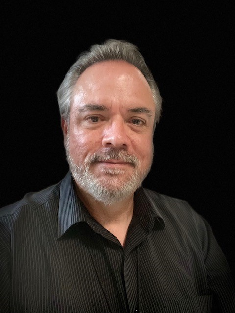 Mr. Michael King, headshot on a black background